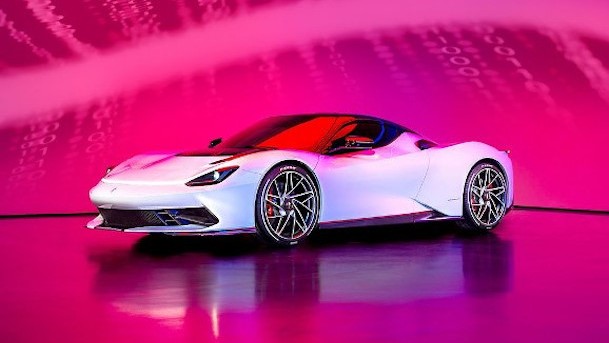 Pininfarina's Battista super sports car in front of magenta background