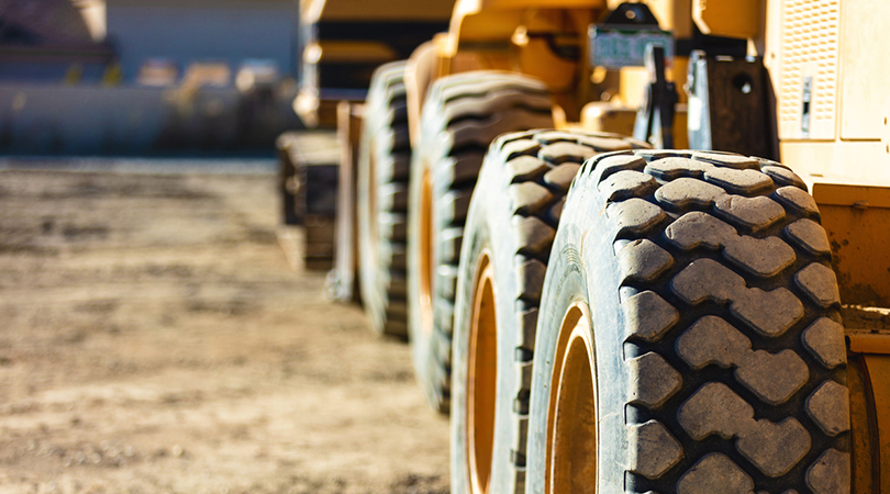 Close up of excavator wheels on construction site