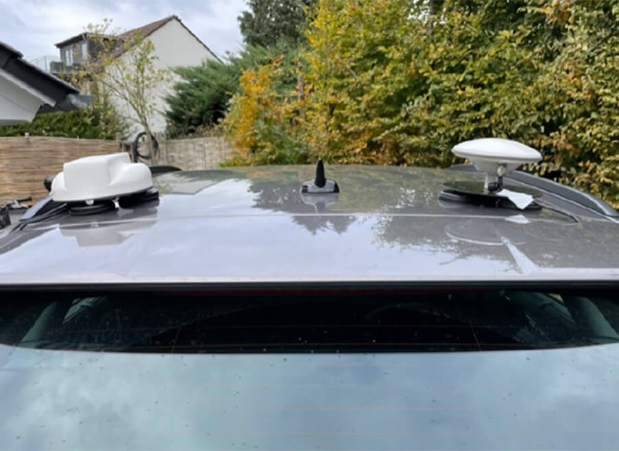 An LTE antenna and two GNSS antennas on the Audi station wagon’s roof