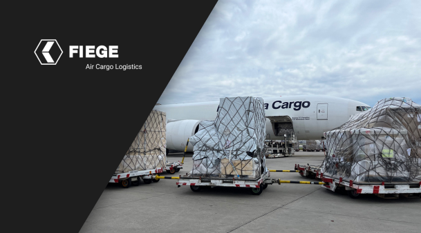 FIEGE Logo on a black background with a picture of airplane cargo