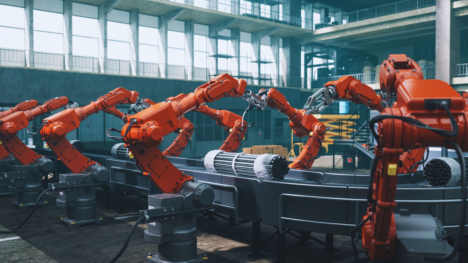 Fabrikhalle mit Roboterarmen und Produktionsband