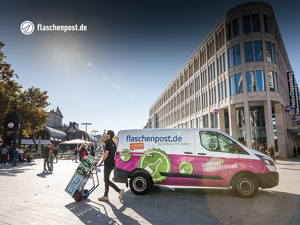 flaschenpost employee transports drinks on a sack truck