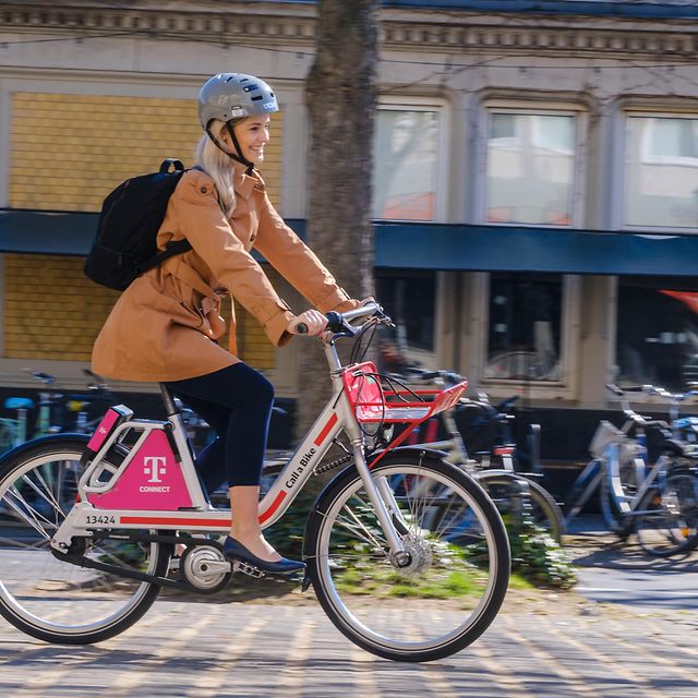 A woman uses Call a Bike, Deutsche Bahn's bikesharing service