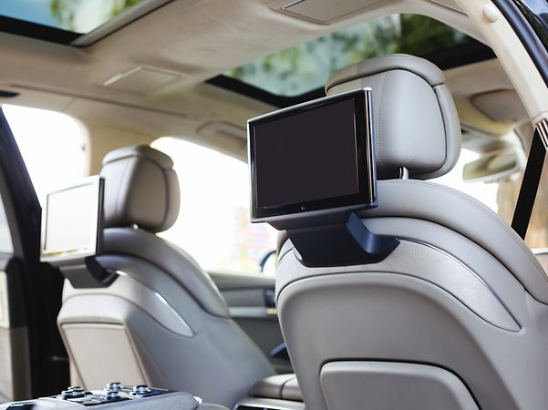 Interior of a vehicle equipped with monitors for the children.