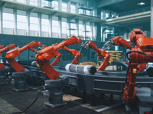 Factory hall with robot arms and production line