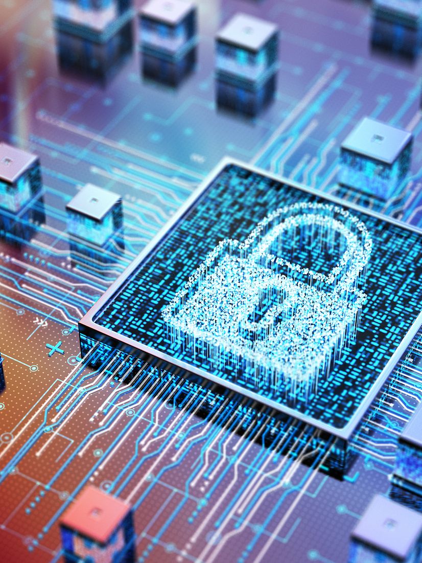 Symbolic image of a digital circuit board with a glowing padlock representing cybersecurity.