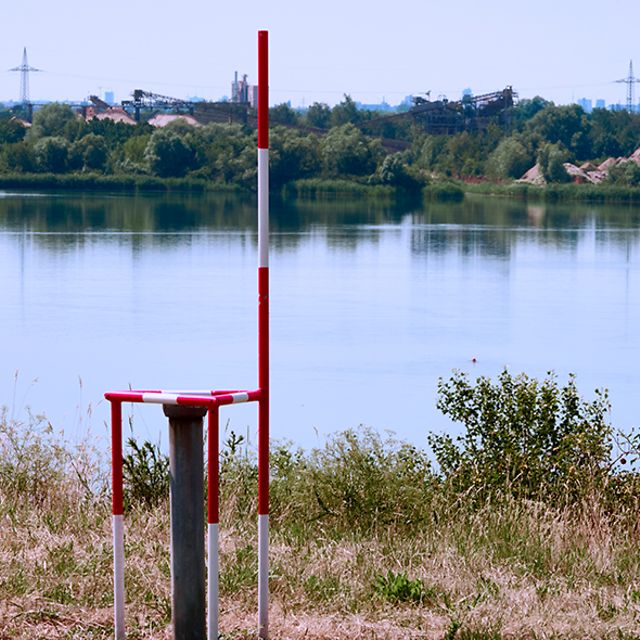 Measuring point for monitoring the groundwater level and water quality of a quarry pond.