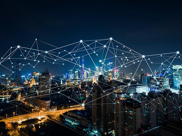 City view with an abstract data network overlay