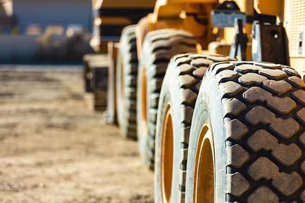 Close up of excavator wheels on construction site