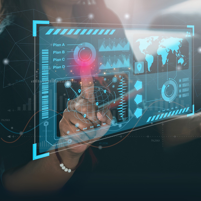 Hand operating a digital touchscreen dashboard with data visualization.