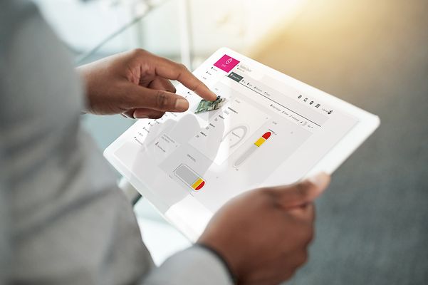 Person operates the Cloud of Things dashboard via a tablet
