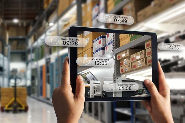 View of a tablet with various tracking data of goods in a logistics center