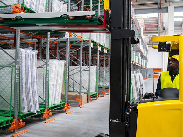 A yellow forklift in a warehouse